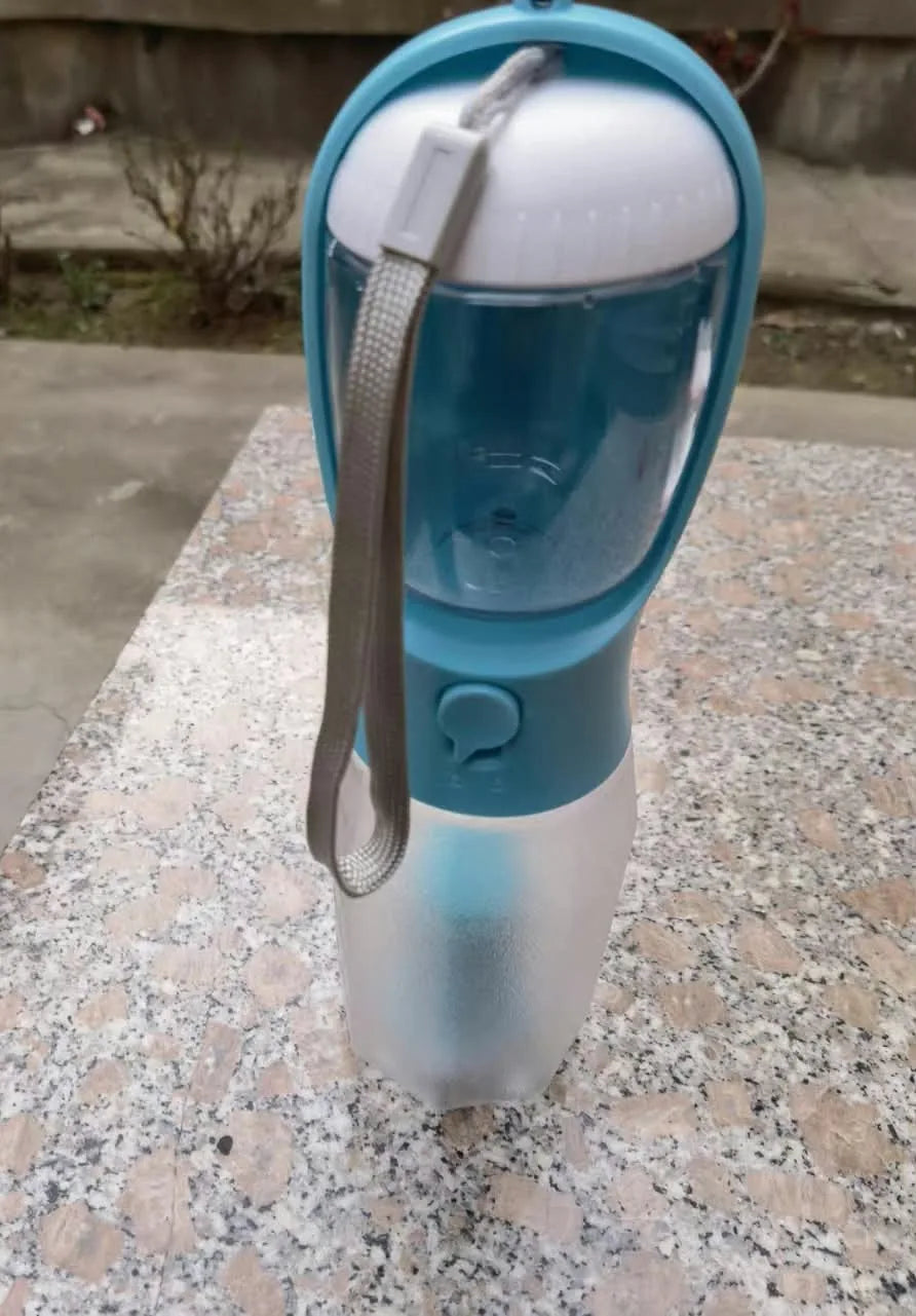 Customer photo of a blue travel bottle outdoors